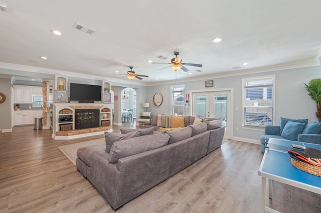102 Terra Cotta Way, Destin, FL 32541 - living area featuring recessed lighting, ceiling fan, arched walkways, light wood-style flooring, and ornamental molding