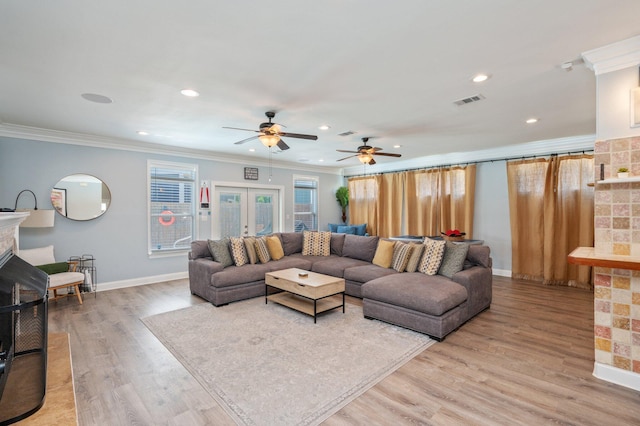 102 Terra Cotta Way, Destin, FL 32541 - living room with a fireplace, crown molding, light wood finished floors, a ceiling fan, and recessed lighting