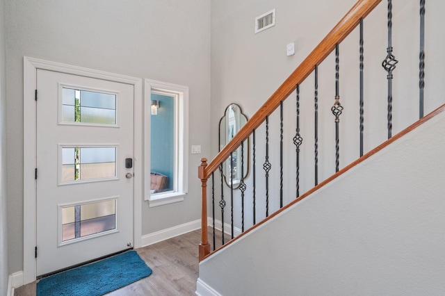 102 Terra Cotta Way, Destin, FL 32541 - entryway with wood finished floors, stairs, and a towering ceiling