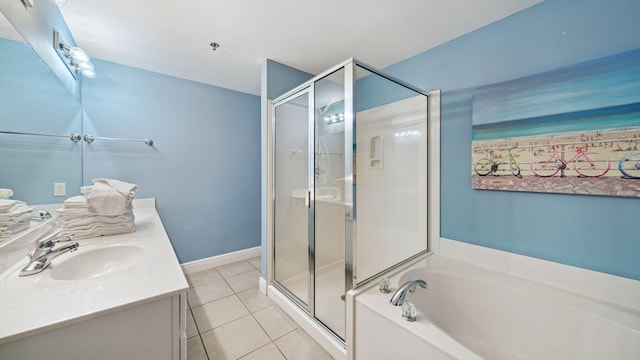 122 Seascape Dr Unit 902, Miramar Beach, FL 32550 - bathroom with a stall shower, vanity, tile patterned floors, and a bath