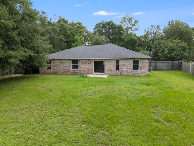 48 S Pleasant Dr, Defuniak Springs, FL 32435 - back of property with a fenced backyard and brick siding