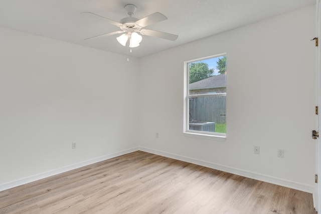 48 S Pleasant Dr, Defuniak Springs, FL 32435 - empty room featuring light wood finished floors and ceiling fan