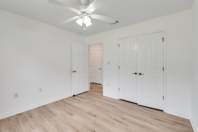 48 S Pleasant Dr, Defuniak Springs, FL 32435 - unfurnished bedroom featuring light wood finished floors, a closet, and ceiling fan