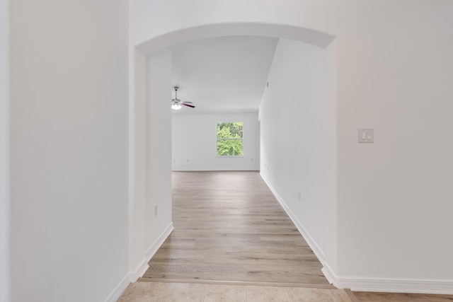 48 S Pleasant Dr, Defuniak Springs, FL 32435 - hallway with arched walkways and light wood-style floors