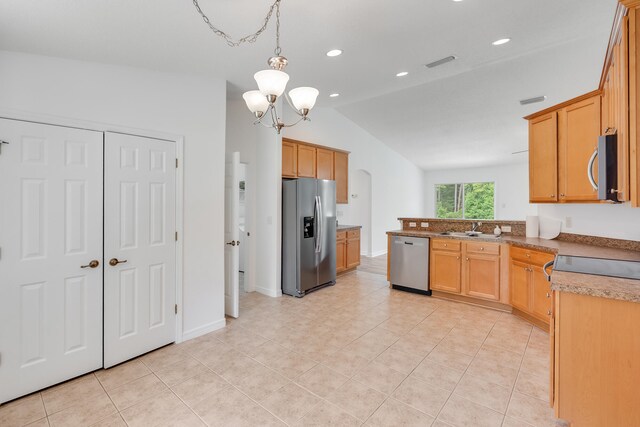 48 S Pleasant Dr, Defuniak Springs, FL 32435 - kitchen with stainless steel appliances, lofted ceiling, light tile patterned flooring, a chandelier, and recessed lighting