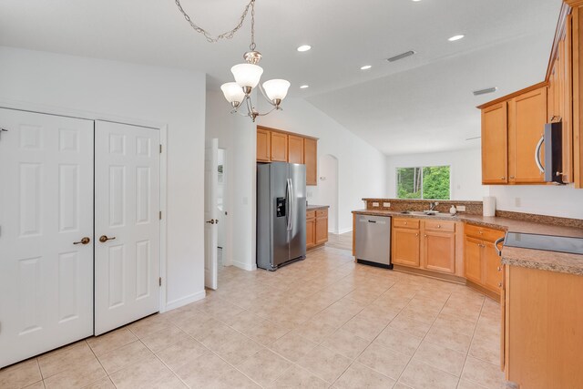 48 S Pleasant Dr, Defuniak Springs, FL 32435 - kitchen featuring stainless steel appliances, lofted ceiling, light tile patterned floors, a chandelier, and recessed lighting