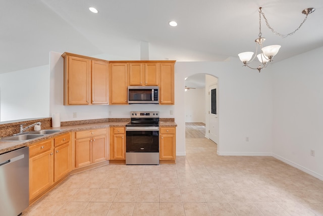 48 S Pleasant Dr, Defuniak Springs, FL 32435 - kitchen with stainless steel appliances, arched walkways, vaulted ceiling, a chandelier, and recessed lighting