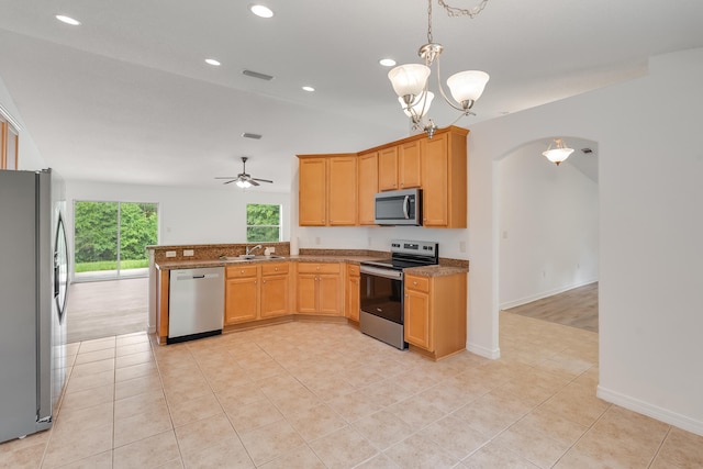 48 S Pleasant Dr, Defuniak Springs, FL 32435 - kitchen featuring appliances with stainless steel finishes, arched walkways, a peninsula, recessed lighting, and a ceiling fan