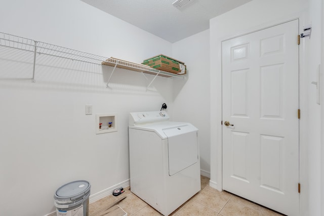 48 S Pleasant Dr, Defuniak Springs, FL 32435 - laundry room with washer / dryer and light tile patterned floors