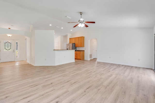 48 S Pleasant Dr, Defuniak Springs, FL 32435 - unfurnished living room with arched walkways, a ceiling fan, lofted ceiling, light wood finished floors, and recessed lighting