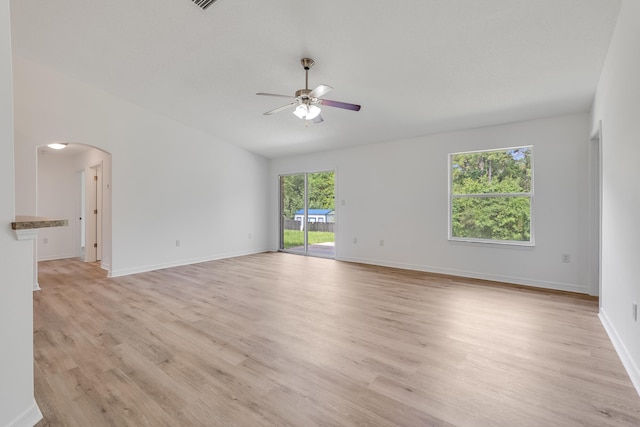 48 S Pleasant Dr, Defuniak Springs, FL 32435 - empty room featuring ceiling fan, light wood-type flooring, and arched walkways