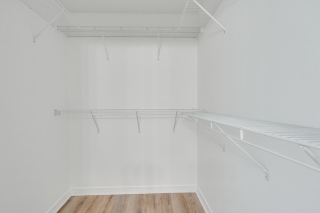 48 S Pleasant Dr, Defuniak Springs, FL 32435 - walk in closet featuring light wood finished floors