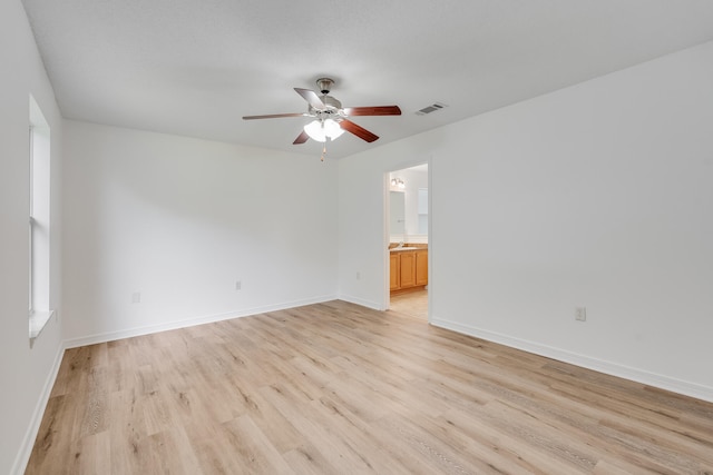 48 S Pleasant Dr, Defuniak Springs, FL 32435 - spare room featuring a ceiling fan and light wood-type flooring