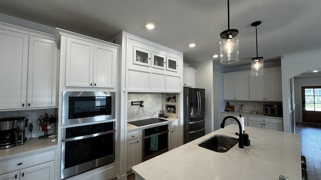 136 Hibernate Way, Freeport, FL 32439 - kitchen with stainless steel appliances, tasteful backsplash, recessed lighting, white cabinetry, and pendant lighting