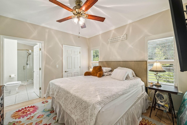 172 Shady Ln, Freeport, FL 32439 - bedroom featuring light wood-style flooring, crown molding, ensuite bathroom, and a ceiling fan