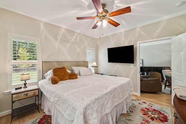172 Shady Ln, Freeport, FL 32439 - bedroom with light wood-style flooring, crown molding, and ceiling fan