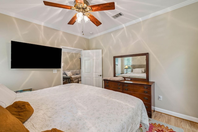 172 Shady Ln, Freeport, FL 32439 - bedroom with crown molding, wood finished floors, and ceiling fan