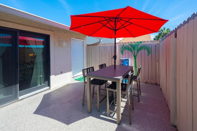 17462 Front Beach Rd Unit 18C, Panama City Beach, FL 32413 - fenced backyard featuring a patio area and outdoor dining area