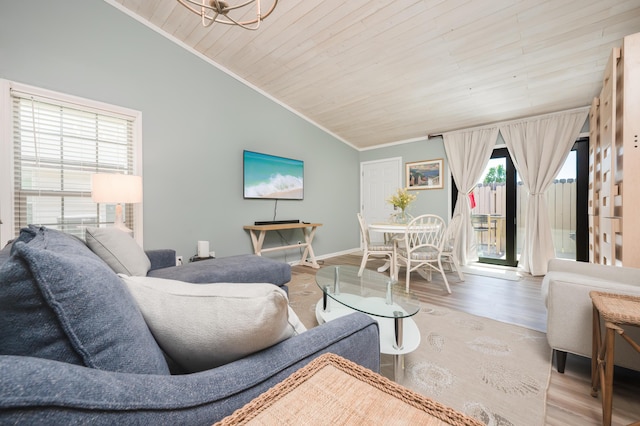 17462 Front Beach Rd Unit 18C, Panama City Beach, FL 32413 - living room featuring vaulted ceiling, wood ceiling, crown molding, and wood finished floors