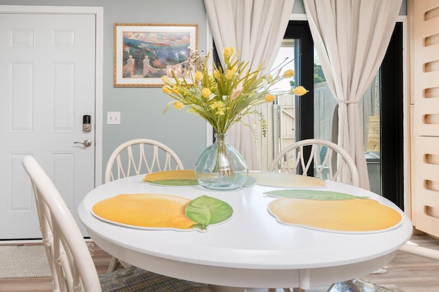 17462 Front Beach Rd Unit 18C, Panama City Beach, FL 32413 - dining area featuring wood finished floors