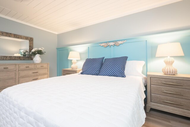 17462 Front Beach Rd Unit 18C, Panama City Beach, FL 32413 - bedroom with wood finished floors, wood ceiling, and crown molding