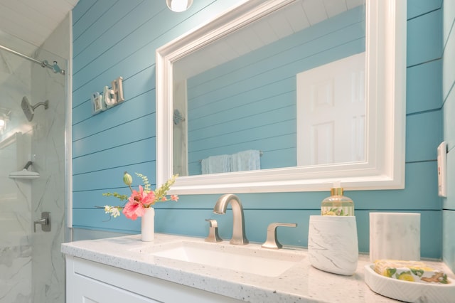 17462 Front Beach Rd Unit 18C, Panama City Beach, FL 32413 - full bath featuring a marble finish shower, vanity, and wood walls