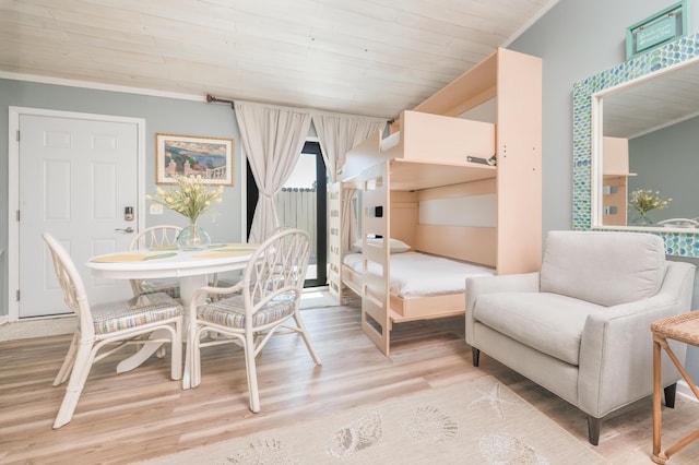 17462 Front Beach Rd Unit 18C, Panama City Beach, FL 32413 - dining room with light wood-style floors, crown molding, and wooden ceiling