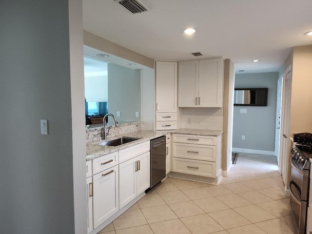 955 Scenic Gulf Dr Unit 410, Miramar Beach, FL 32550 - kitchen with appliances with stainless steel finishes, white cabinets, light stone countertops, light tile patterned floors, and recessed lighting
