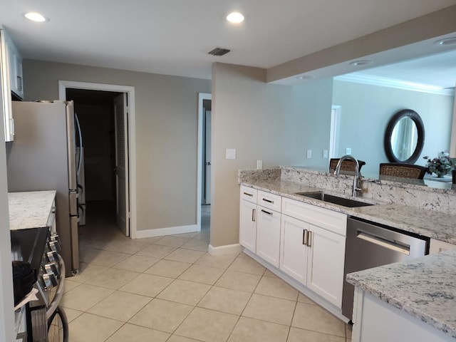 955 Scenic Gulf Dr Unit 410, Miramar Beach, FL 32550 - kitchen with appliances with stainless steel finishes, white cabinetry, light stone countertops, light tile patterned flooring, and recessed lighting