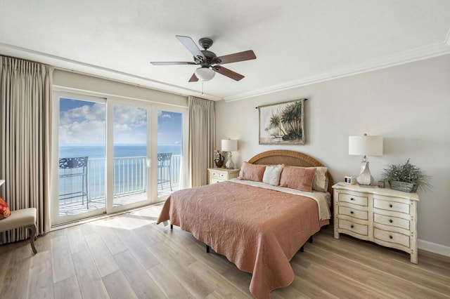955 Scenic Gulf Dr Unit 410, Miramar Beach, FL 32550 - bedroom featuring access to outside, a water view, light wood-style flooring, crown molding, and ceiling fan