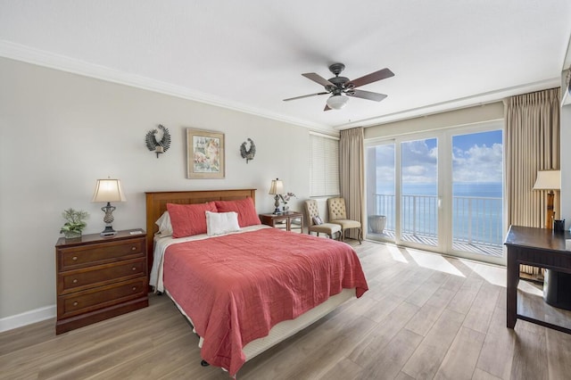 955 Scenic Gulf Dr Unit 410, Miramar Beach, FL 32550 - bedroom featuring access to outside, wood finished floors, crown molding, a water view, and ceiling fan
