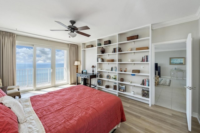 955 Scenic Gulf Dr Unit 410, Miramar Beach, FL 32550 - bedroom with access to exterior, crown molding, light wood-style flooring, a water view, and a ceiling fan