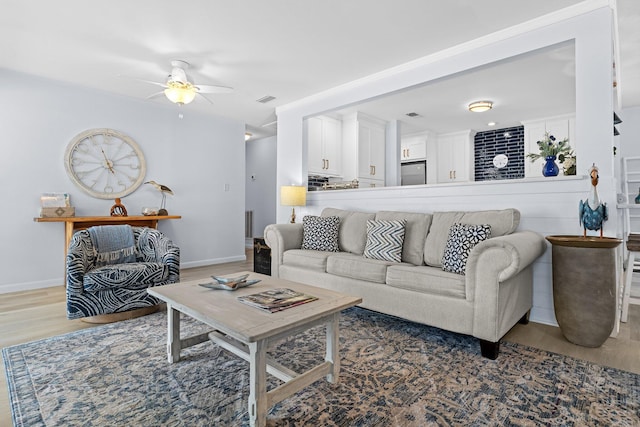 727 Sandpiper Pl # 10516, Miramar Beach, FL 32550 - living room featuring wood finished floors and ceiling fan