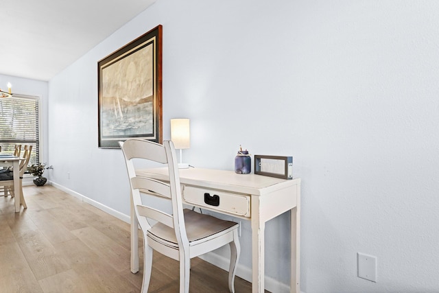 727 Sandpiper Pl # 10516, Miramar Beach, FL 32550 - home office featuring light wood-style flooring and a chandelier