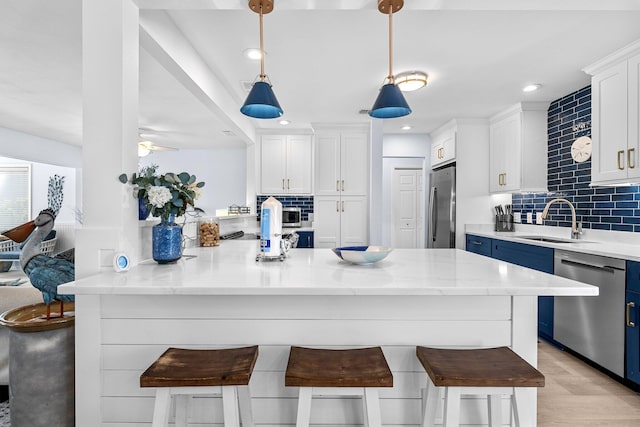 727 Sandpiper Pl # 10516, Miramar Beach, FL 32550 - kitchen with stainless steel appliances, tasteful backsplash, white cabinets, and recessed lighting