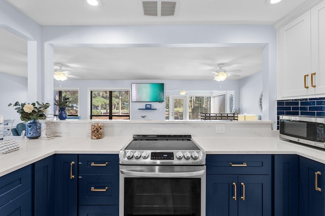727 Sandpiper Pl # 10516, Miramar Beach, FL 32550 - kitchen featuring stainless steel appliances, ceiling fan, blue cabinetry, white cabinetry, and recessed lighting