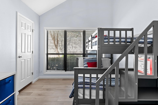 727 Sandpiper Pl # 10516, Miramar Beach, FL 32550 - bedroom featuring lofted ceiling and wood finished floors