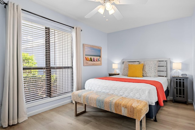 727 Sandpiper Pl # 10516, Miramar Beach, FL 32550 - bedroom featuring multiple windows, wood finished floors, and ceiling fan