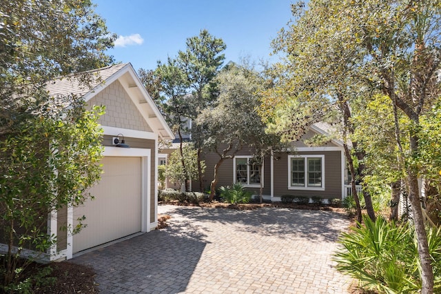 9 W Salt Box Ln, Watersound, FL 32461 - view of home's exterior with a garage, driveway, and an outbuilding