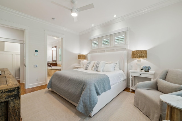 9 W Salt Box Ln, Watersound, FL 32461 - bedroom with crown molding, light wood-style flooring, connected bathroom, a ceiling fan, and recessed lighting