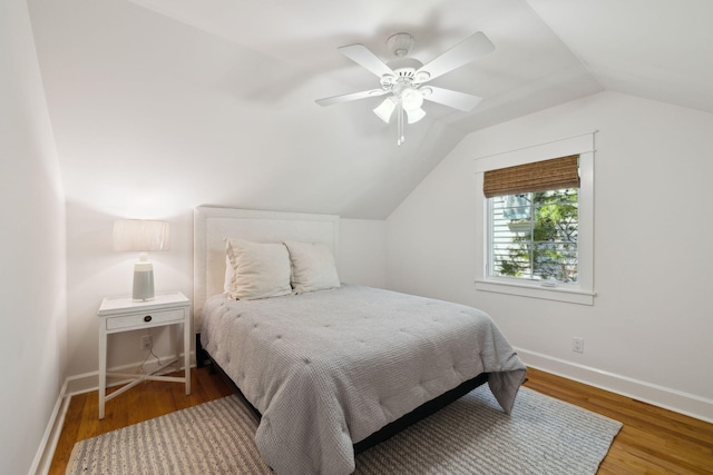 9 W Salt Box Ln, Watersound, FL 32461 - bedroom featuring vaulted ceiling, wood finished floors, and a ceiling fan