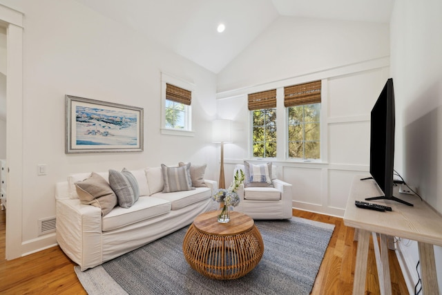 9 W Salt Box Ln, Watersound, FL 32461 - living area featuring wood finished floors, high vaulted ceiling, and recessed lighting