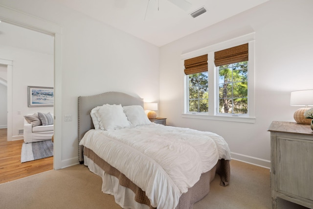 9 W Salt Box Ln, Watersound, FL 32461 - bedroom with a ceiling fan and light wood-style floors