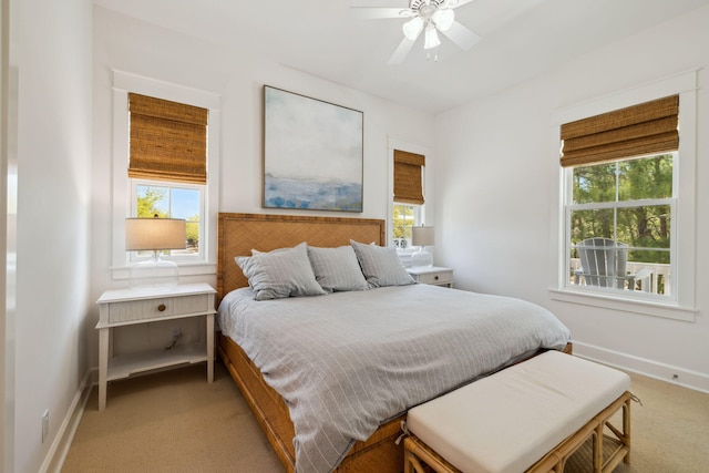 9 W Salt Box Ln, Watersound, FL 32461 - bedroom featuring multiple windows, light colored carpet, and ceiling fan