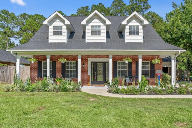 3228 Mcmillan Creek Dr, Milton, FL 32583 - new england style home featuring a porch, brick siding, and a shingled roof