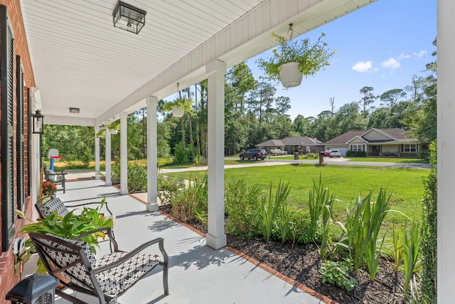 3228 Mcmillan Creek Dr, Milton, FL 32583 - covered porch with a yard