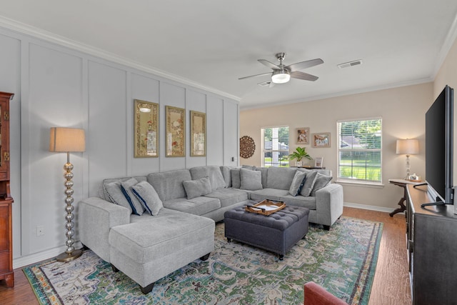 3228 Mcmillan Creek Dr, Milton, FL 32583 - living room with ornamental molding, a ceiling fan, and wood finished floors