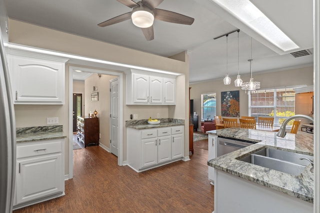 3228 Mcmillan Creek Dr, Milton, FL 32583 - kitchen with dark wood-style floors, a chandelier, white cabinetry, decorative light fixtures, and ceiling fan