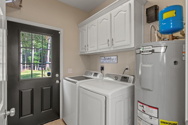 3228 Mcmillan Creek Dr, Milton, FL 32583 - laundry area with water heater, washer and clothes dryer, cabinet space, and plenty of natural light