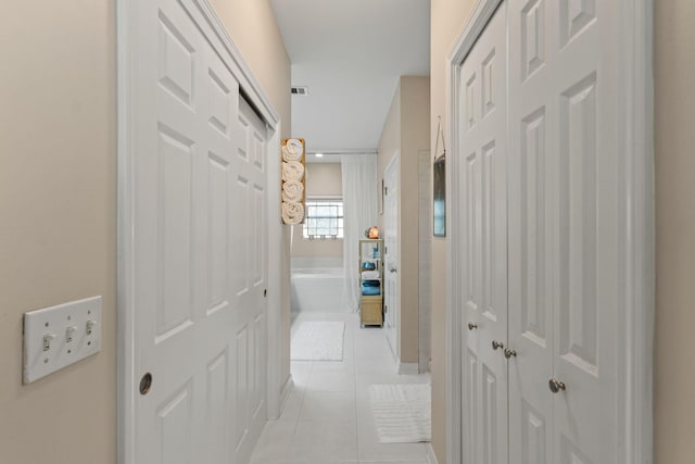 3228 Mcmillan Creek Dr, Milton, FL 32583 - hallway featuring light tile patterned floors